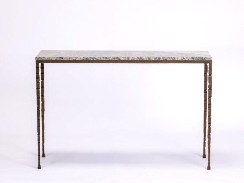 Rectangular table with a gray marble top and ornate segmented wooden legs, set against a plain white background.